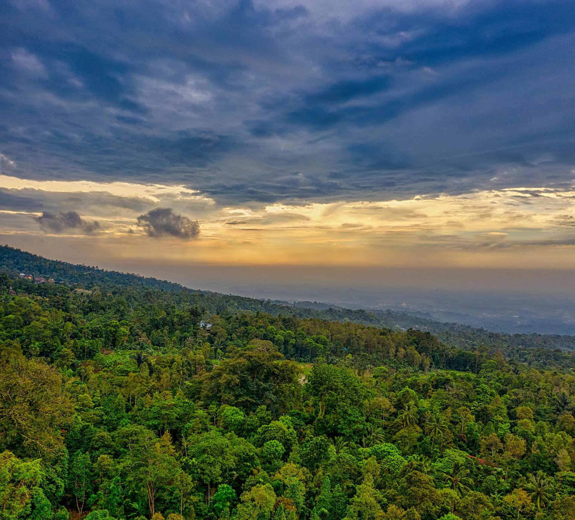 Rainforest crater viewpoint in Sabah with lava-orange evening light